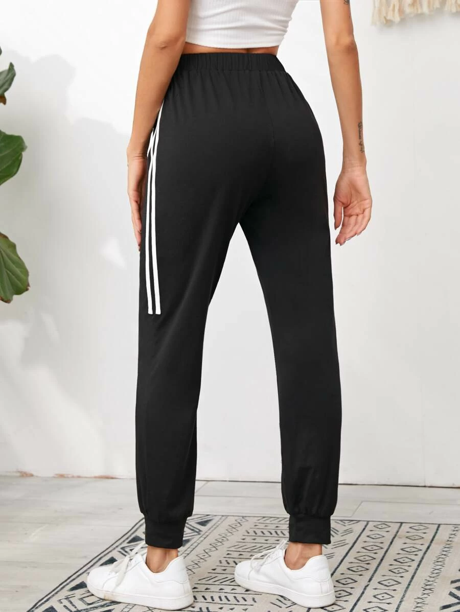 https://www.styched.in/cdn/shop/products/KnotElasticWaistStripedSideJoggersback.png?v=1611236987&width=1445